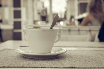 cup with coffee on the table