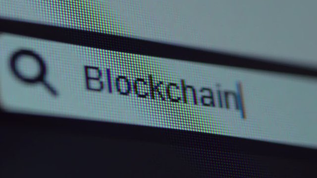 Browser bar with typed Blockchain text on the computer monitor. Search Engine Concept. Shot in 4k resolution