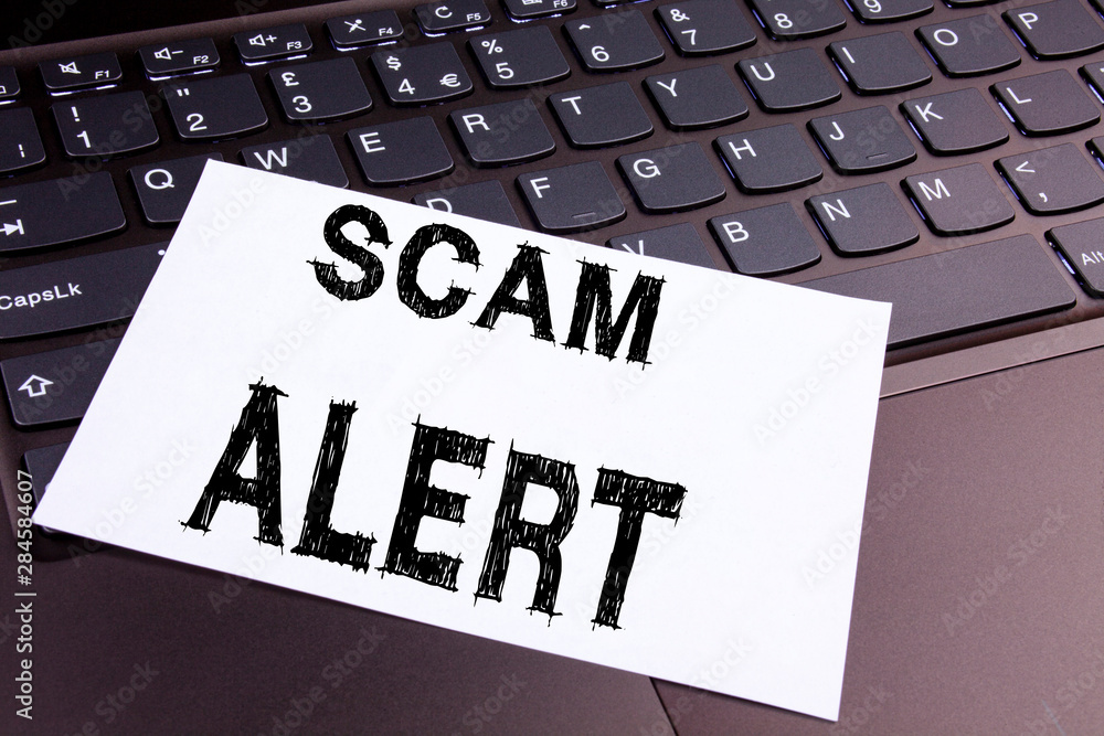 Poster scam alert writing text made in the office close-up on laptop computer keyboard. business concept fo