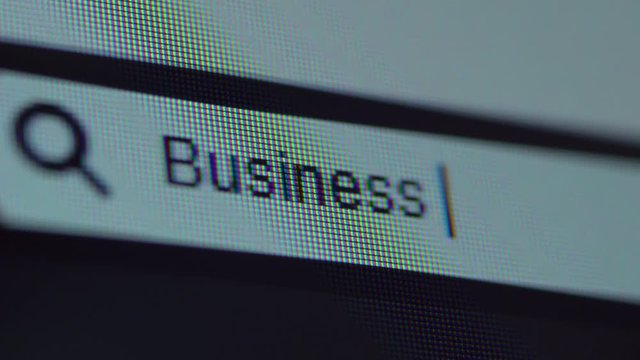 Browser bar with typed Business Id text on the computer monitor. Shot in 4k resolution