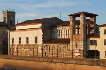 Romanesque San Matteo Church facade in Pisa, Italy, at sunset