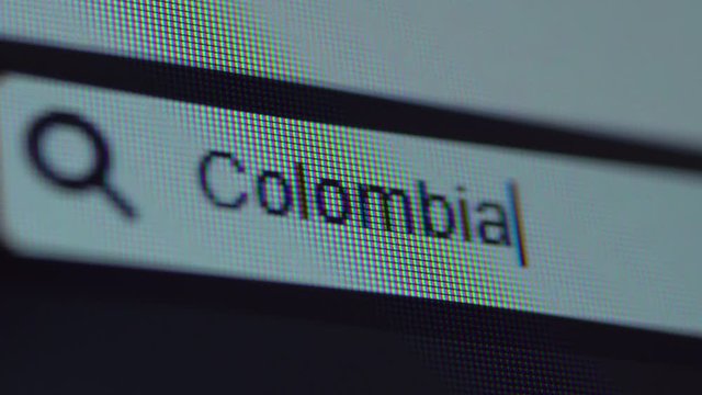 Browser bar with typed Colombia text on the computer screen. Shot in 4k resolution