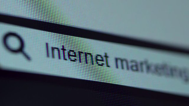 Browser bar with typed Internet Marketing text on the computer monitor. Search Engine Concept. Shot in 4k resolution