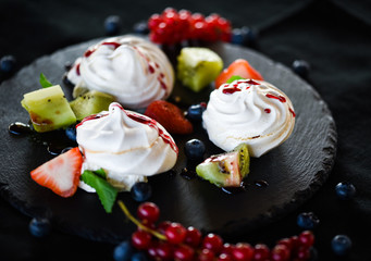 delicious pavlova sweet with fresh fruits