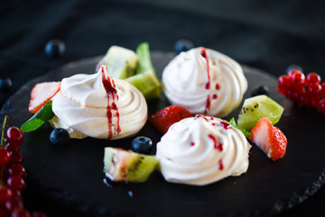 delicious pavlova sweet with fresh fruits