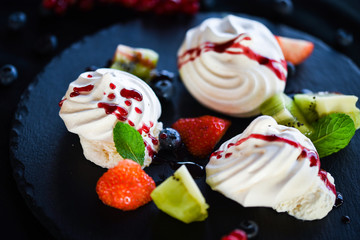 delicious pavlova sweet with fresh fruits