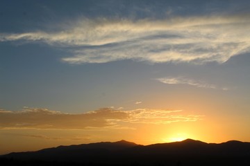 Heavens illuminate as sun sets over the Hexie Mountains of Joshua Tree National Park. Although much of the range is within the Mojave, its edges transition and integrate with the Colorado Desert.
