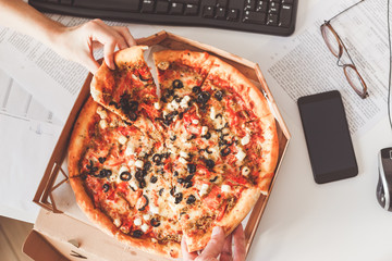 Business Lunch at the workplace. Vegetarian pizza sharing