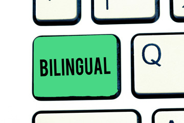 Handwriting text writing Bilingual. Concept meaning speaking two languages fluently or more work as translator Keyboard key Intention to create computer message, pressing keypad idea