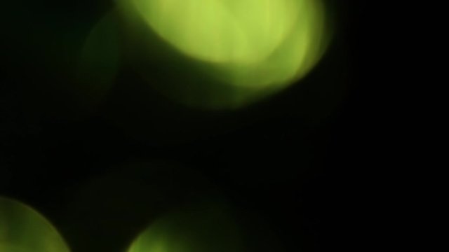 Blurred green light glare on black background HD 1920x1080