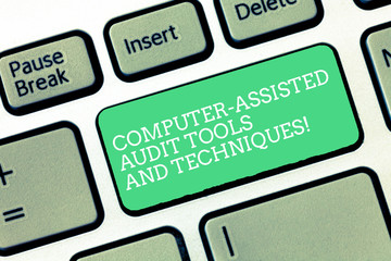 Conceptual hand writing showing Computer Assisted Audit Tools And Techniques. Business photo text Modern auditing applications Keyboard Intention to create computer message keypad idea