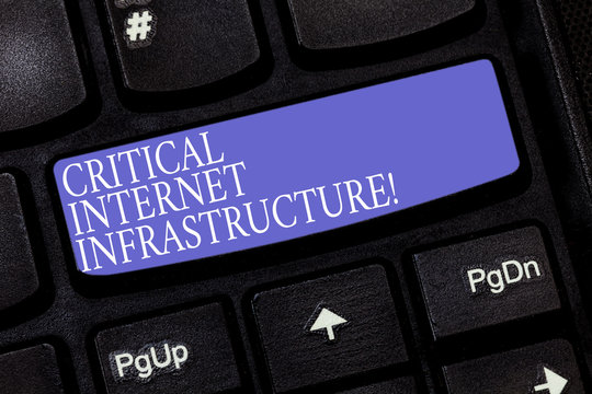 Handwriting text Critical Internet Infrastructure. Concept meaning essential components of internet operation Keyboard key Intention to create computer message pressing keypad idea