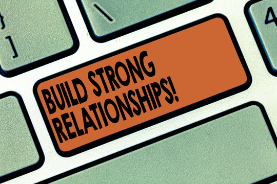 Handwriting text writing Build Strong Relationships. Concept meaning initiate good working relationships with others Keyboard key Intention to create computer message pressing keypad idea