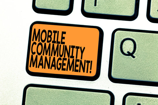 Text sign showing Mobile Community Management. Conceptual photo building relationships with online community Keyboard key Intention to create computer message pressing keypad idea