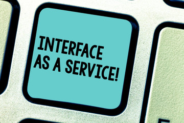 Fototapeta premium Handwriting text writing Interface As A Service. Concept meaning Information technologies assistance support Keyboard key Intention to create computer message pressing keypad idea