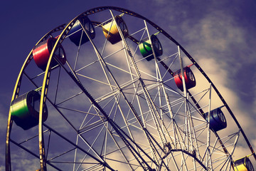 carousel, ferris wheel in an amusement park