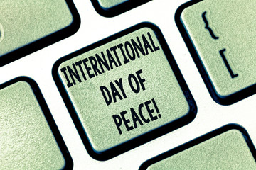 Text sign showing International Day Of Peace. Conceptual photo Worldwide peaceful celebration Hope freedom Keyboard key Intention to create computer message pressing keypad idea