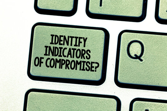 Handwriting text writing Identify Indicators Of Compromise. Concept meaning Detect malware online attacks hacking Keyboard key Intention to create computer message pressing keypad idea