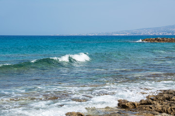 Seascape of the Mediterranean Sea with waves of the turquoise sea on the volcanic coast of Cyprus