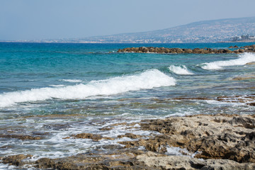 Seascape of the Mediterranean Sea with waves of the turquoise sea on the volcanic coast of Cyprus