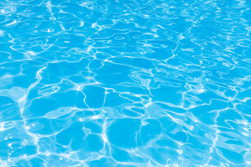 Blue water in pool for background and abstract, Ripple wave with sun reflection in swimming pool