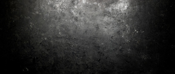 Rough, dark stone background lit by spotlight background - 284598806