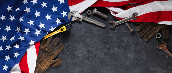 Construction and manufacturing tools with patriotic US, USA, American flag on dark black background