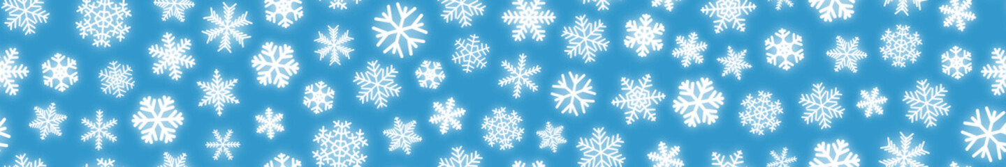 Obraz premium Christmas horizontal seamless banner of white snowflakes on light blue background