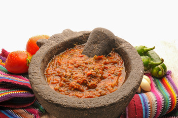 Mexican salsa with tomato and garlic chili made in molcajete