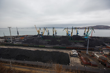 Coal terminal in the sea trading port of the sea city of Nakhodka. Coal collapse on the coast of a...