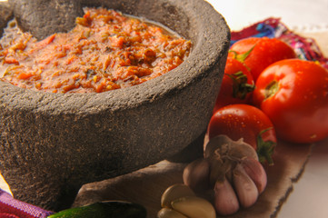 Mexican salsa with tomato and garlic chili made in molcajete