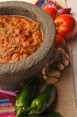 Mexican salsa with tomato and garlic chili made in molcajete