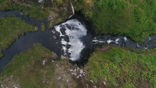 Aerial view of waterfall Clashnessie Falls in Scotland NC 500