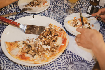 People eating gourmet mushroom funghi pizza