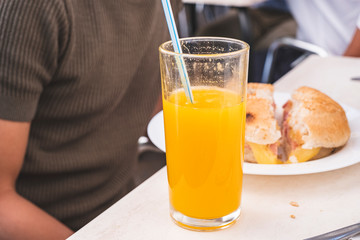 Drinking OJ and eating