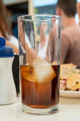 Brown cola soda in a glass