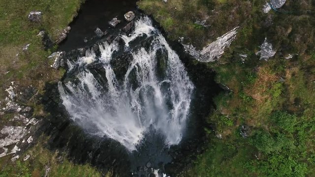 Aerial view of waterfall Clashnessie Falls in Scotland NC 500