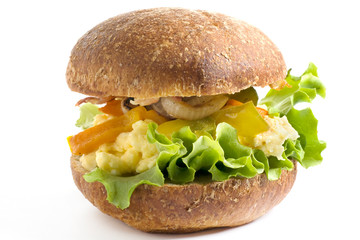 breakfast bun - scrambled eggs and bacon, isolated on white