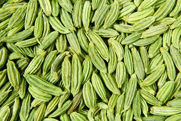 dried fennel seeds or Saunf herb texture background,top view 
