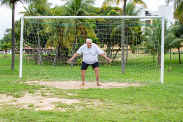 Fat old man practices sport, obese