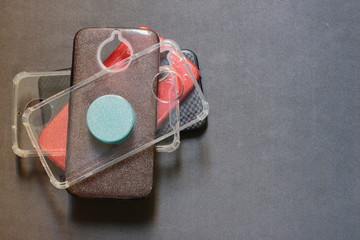 cell phone, mobile case in a black background. Cases it's important to protect devices from falling down, screen crashes and bad function