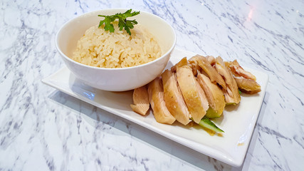 Steam Chicken with Rice on white plate. Khao Man Kai