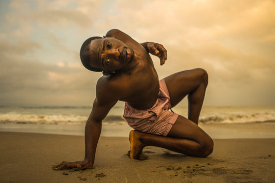 Contemporary Dance Choreographer And Dancer Doing Ballet Beach Workout . A Young Attractive And Athletic Black African American Man Dancing In Dramatic Performance