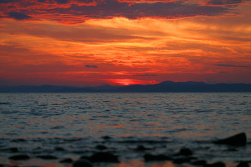 Beautiful sea sunset. Colored sunset on the sea.