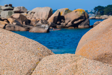Seascape with huge pink granite boulders near Plumanach. The coast of pink granite is a unique place in Brittany. France