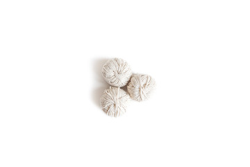 Balls of white yarn. Isolated skein of wool boho logo. Space for text