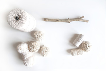 Boho white mockup with cotton yarn on the desk. Top view flat lay. Space for your text