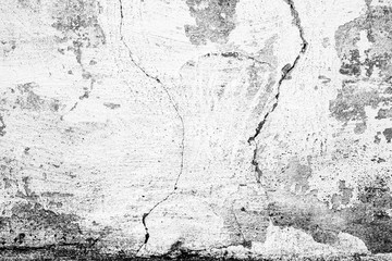 Fototapeta premium Texture of a concrete wall with cracks and scratches which can be used as a background