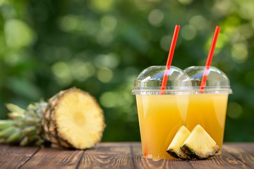 pineapple juice in disposable plastic cups