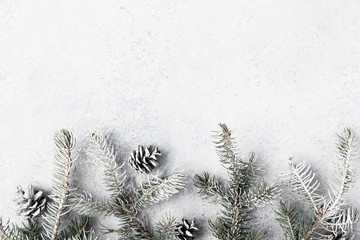 Christmas background with decorations and gift boxes on grey textured board or table